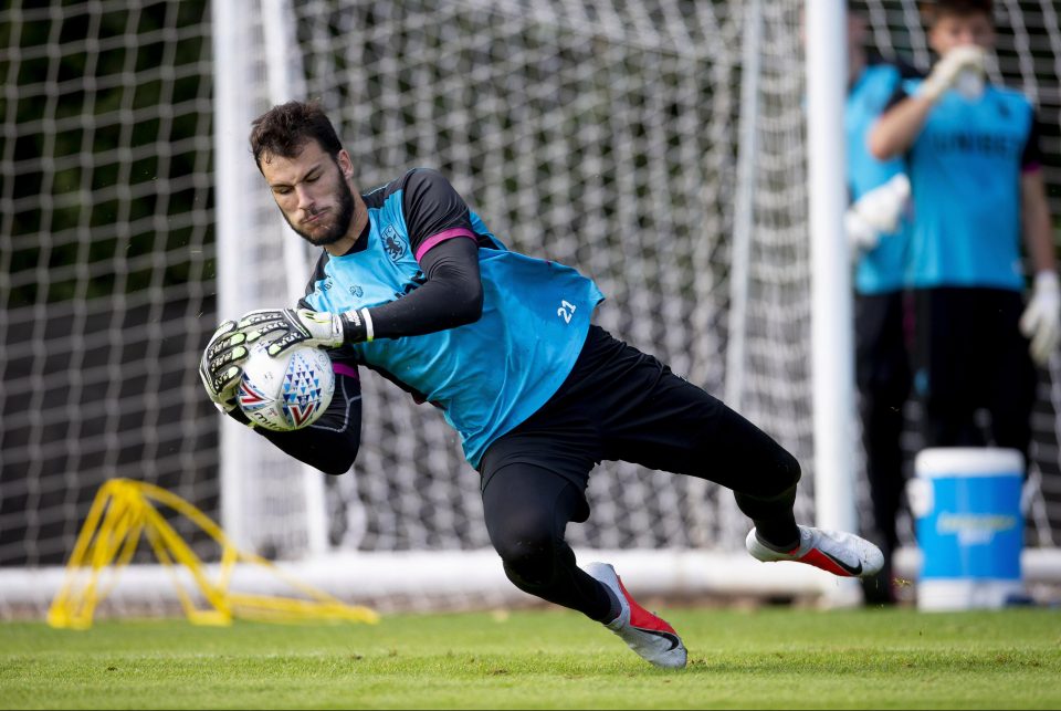  Villa keeper Andre Moreira hurls himself into action at their training ground