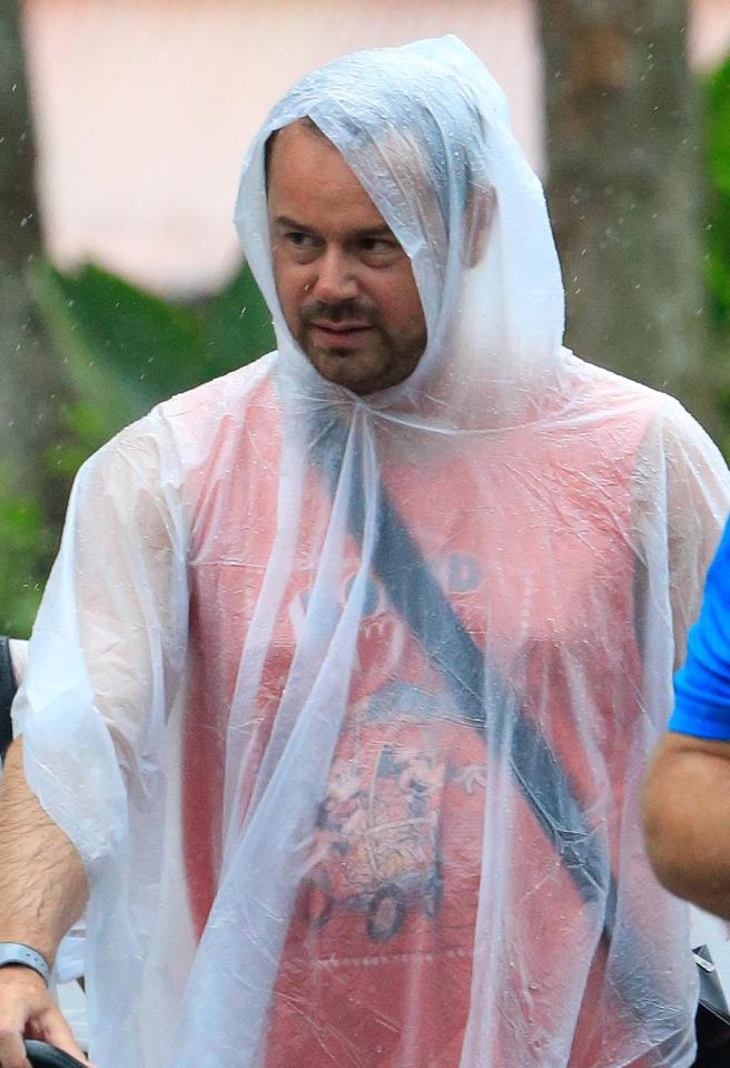  Danny Dyer did not look pleased to get caught in the rain