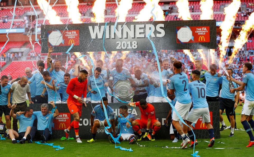  Manchester City celebrate winning the Community Shield after beating Chelsea