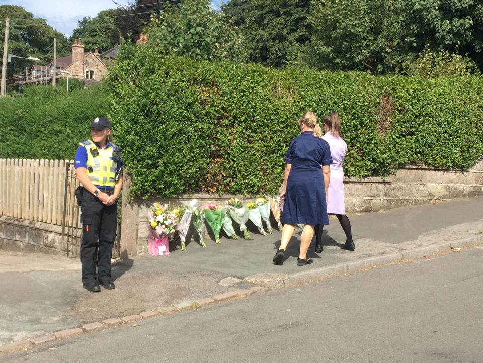  Two nurses from the Royal Stoke Hospital lay a floral tribute for their work colleague, Samantha