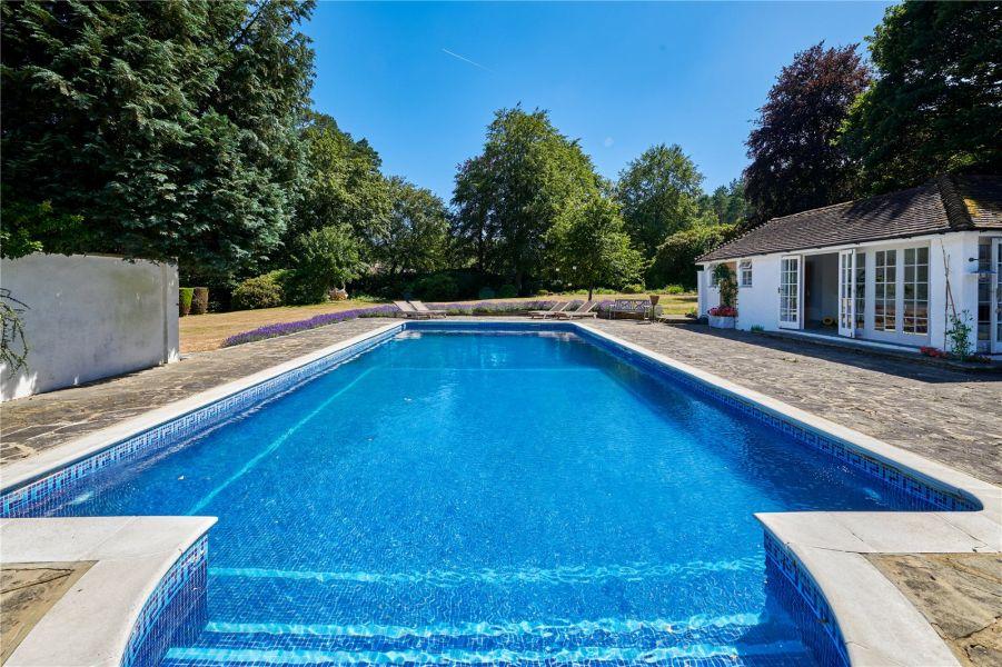 The property boasts a large outdoor swimming pool