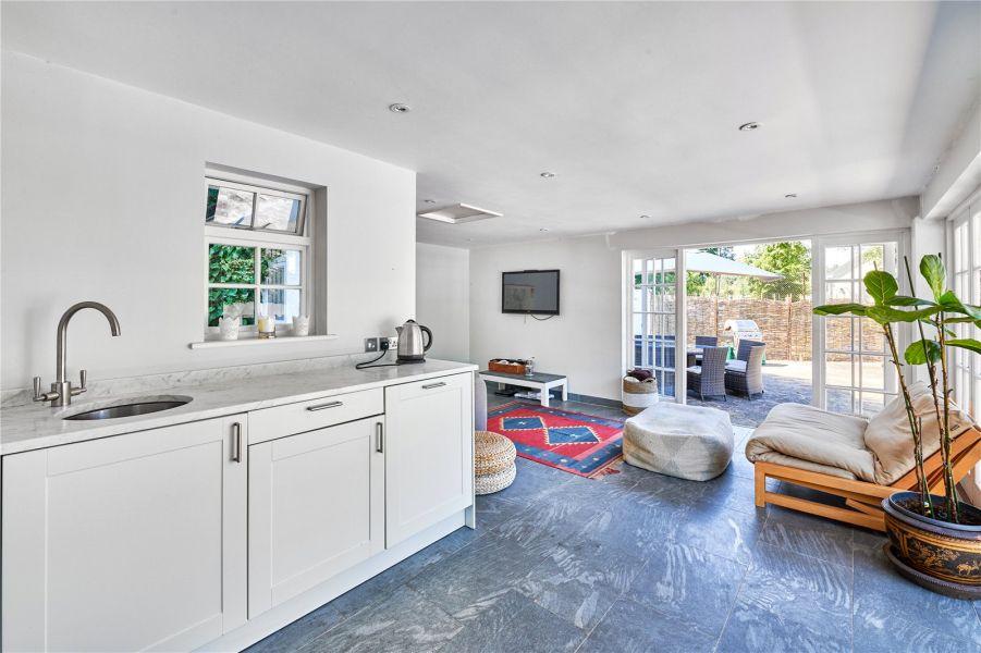 A doorway leads out from the kitchen to the pretty garden