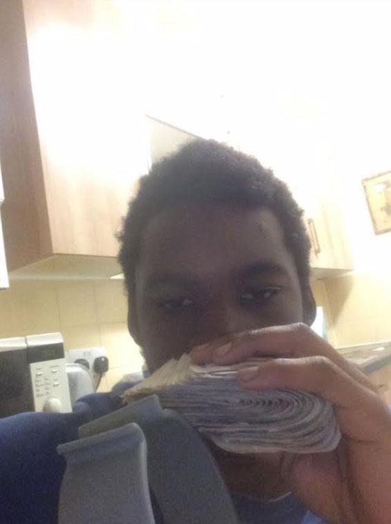  Webster - who was a member of the 12 World gang - poses with cash said to be earned from drug dealing