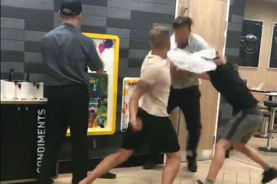  Two thugs were filmed attacking a McDonald's employee after he had asked them to leave