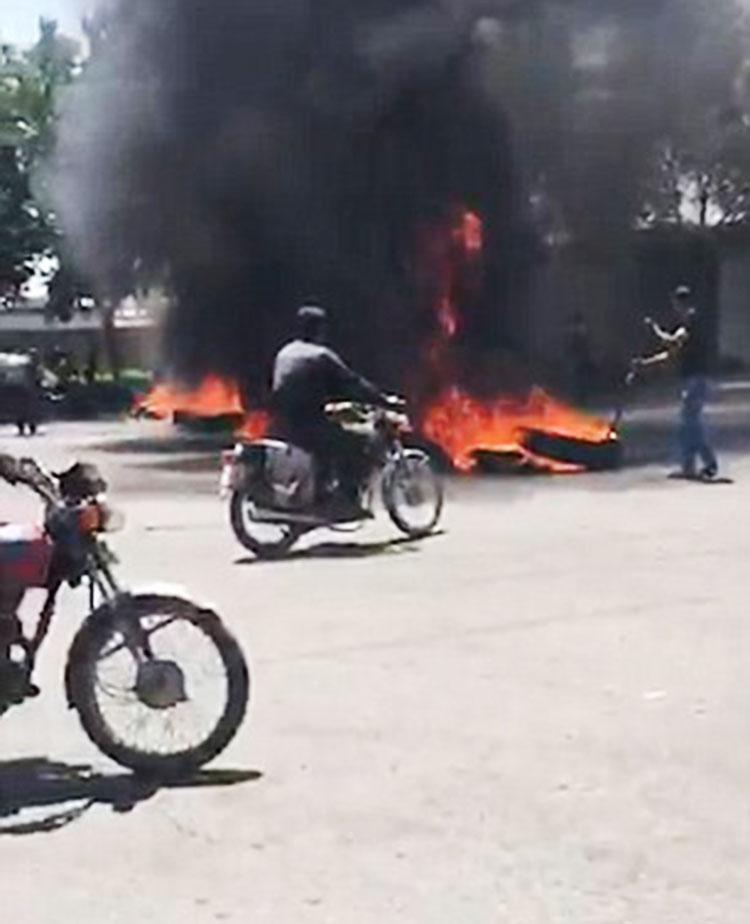  Protesters opened fire in the streets of Iran over Donald Trump's sanctions