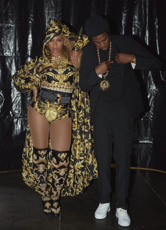  Showbiz power couple Beyonce and Jay-Z won't be running anywhere in these heavy-looking stage outfits