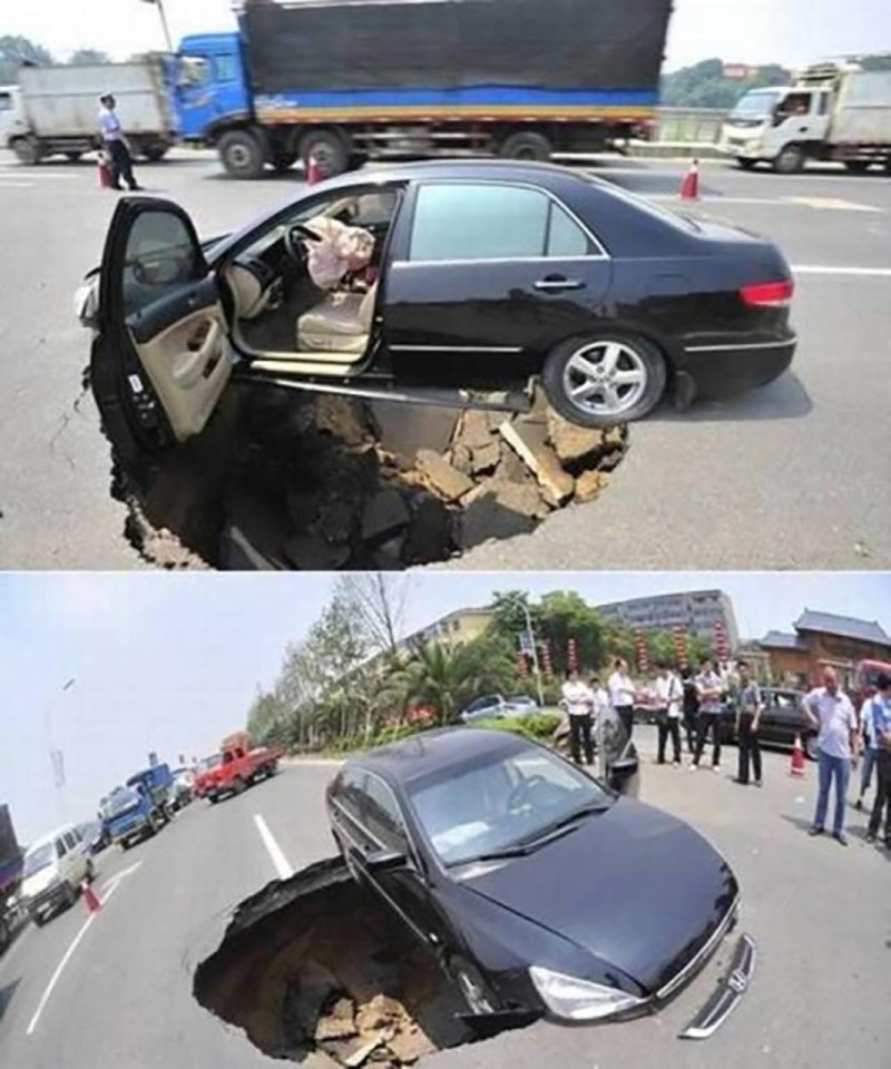 Somehow this motor avoided being sucked into a sinkhole which opened up in the middle of the road