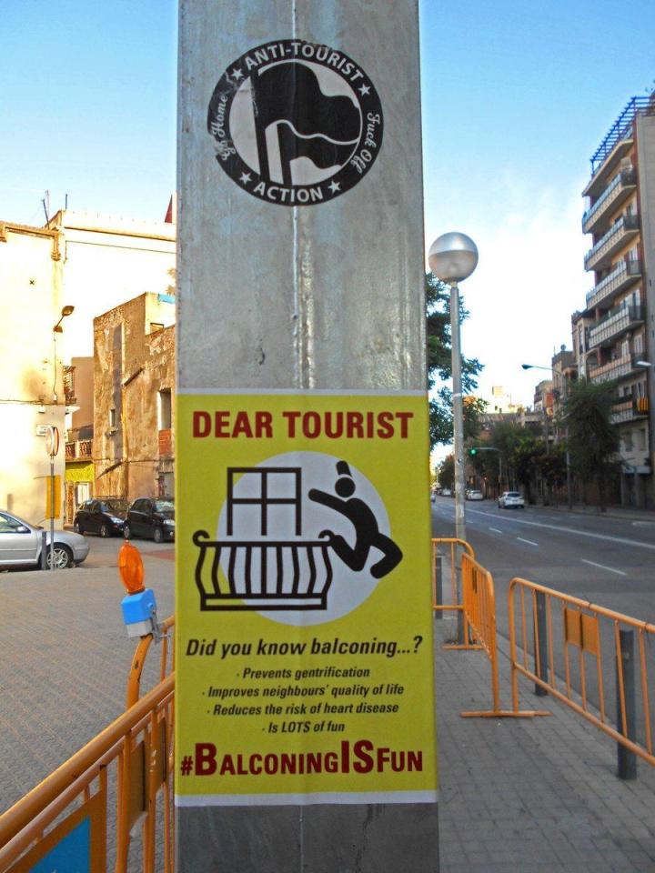  Pictured is the sick sign encouraging Brits to perform deadly 'balconing' stunts in Barcelona