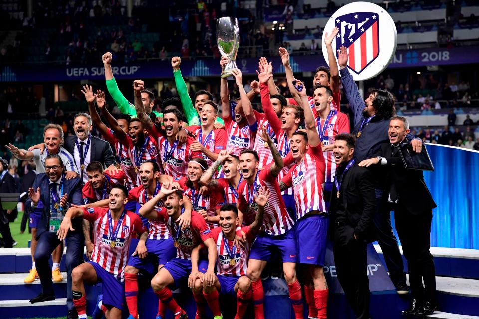  Atletico Madrid celebrate after beating their bitter rivals to Super Cup glory