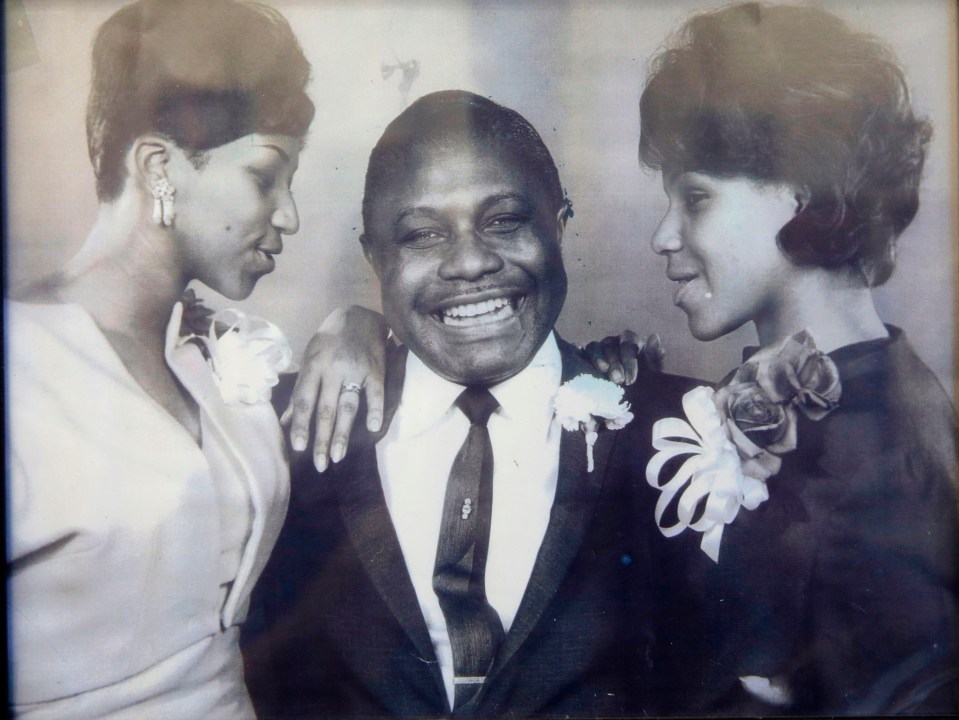 Aretha, left, pictured with her father and sister, had a turbulent life