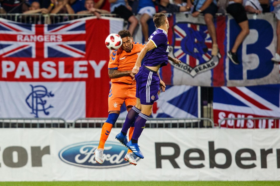 James Tavernier of Rangers wins a header in the second half