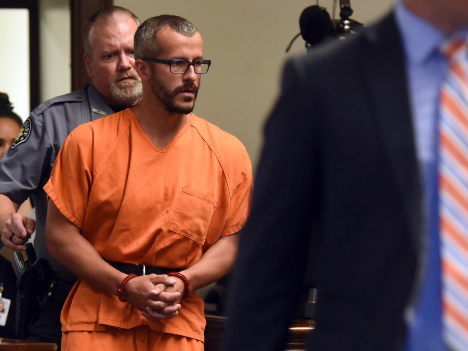  Christopher Watts, pictured being escorted into a courtroom before his bond hearing, today pleaded guilty to nine charges including the murder of his pregnant wife and two young daughters