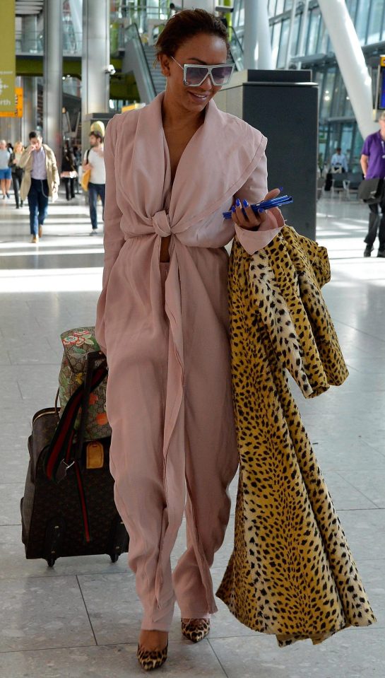  Mel travels in a cosy outfit, but keeps an officially scary leopard-print number on standby