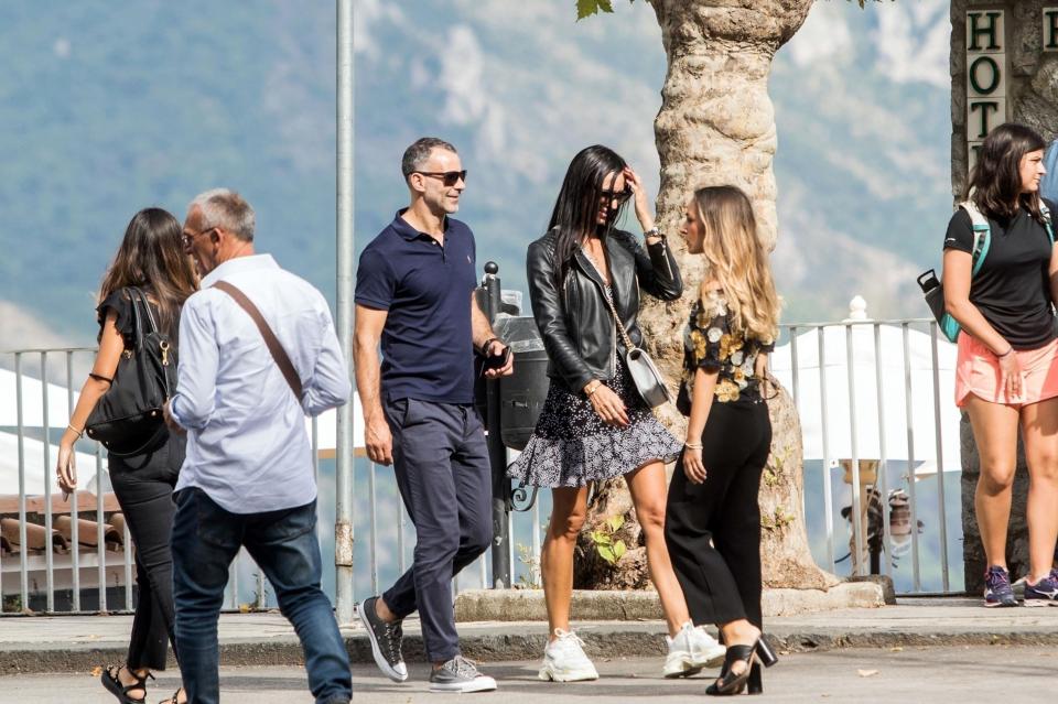  Kate teamed up a pair of white chunky trainers with a black leather jacket for their romantic stroll