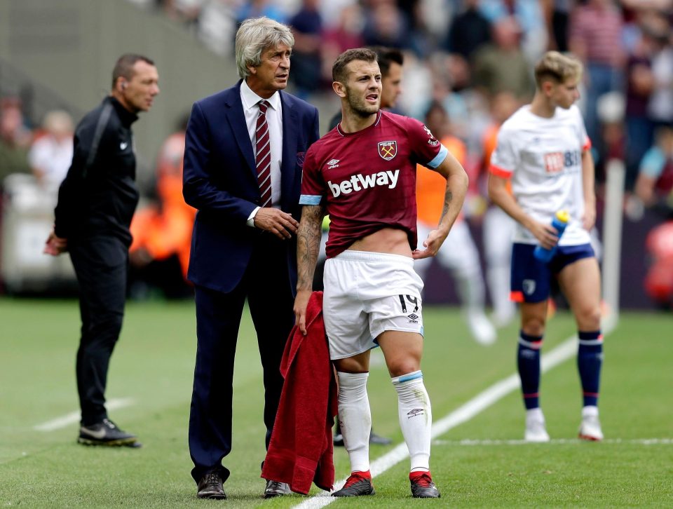  Jack Wilshere chats with West Ham manager Manuel Pellegrini as fortunes change