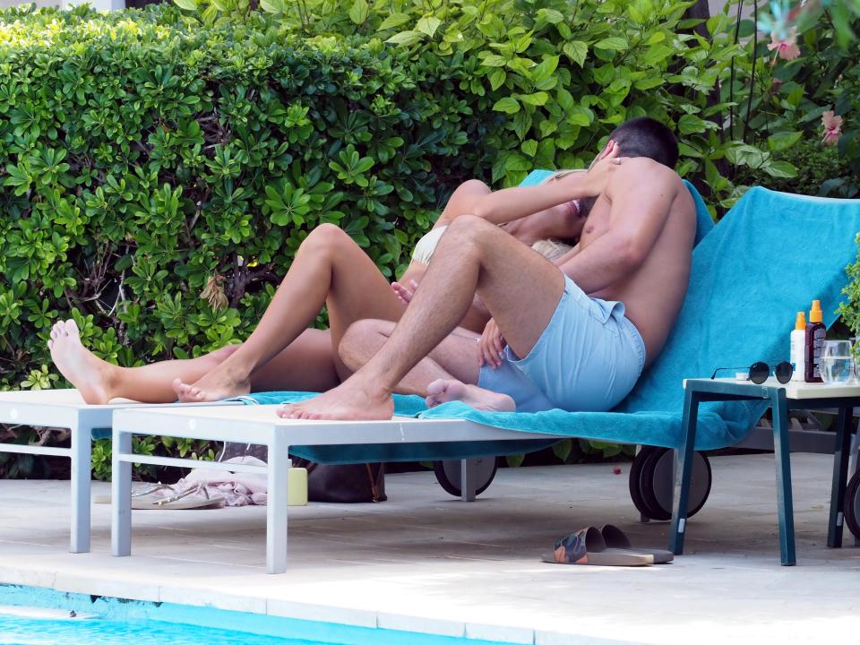  The couple shared a romantic kiss on the sunlounger