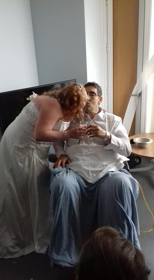  The couple share a kiss during the ceremony in front of friends and family