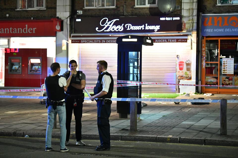  Police stand outside the cordon on Kingsbury Road