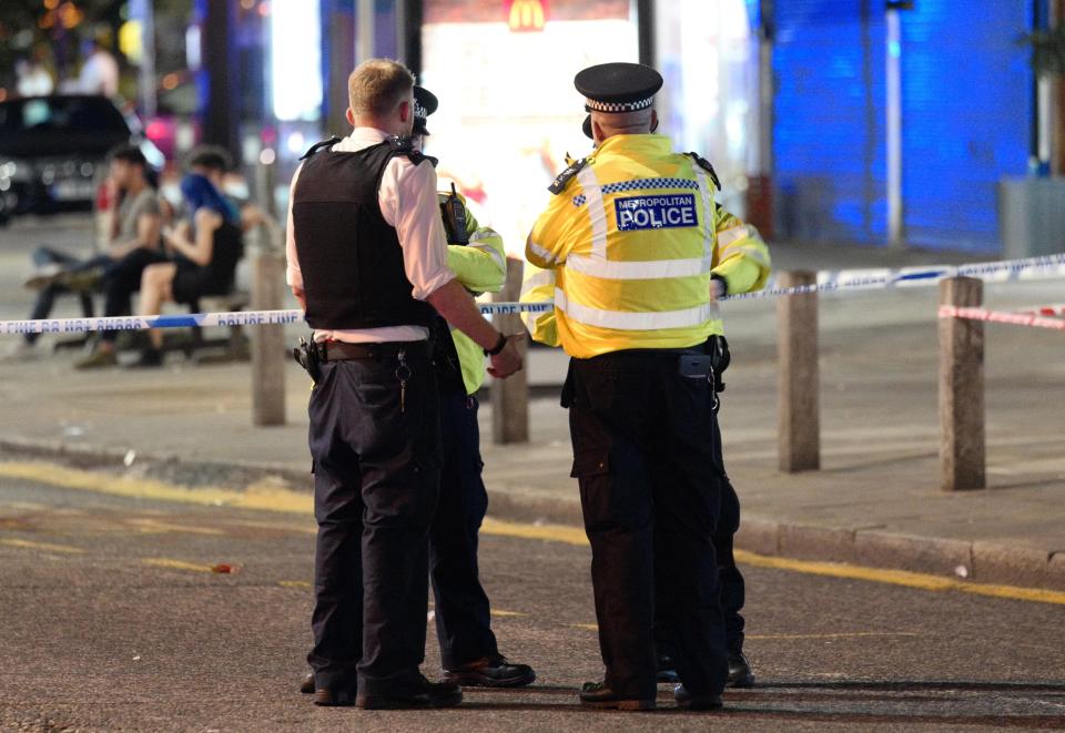  Police stand outside the cordon on Kingsbury Road