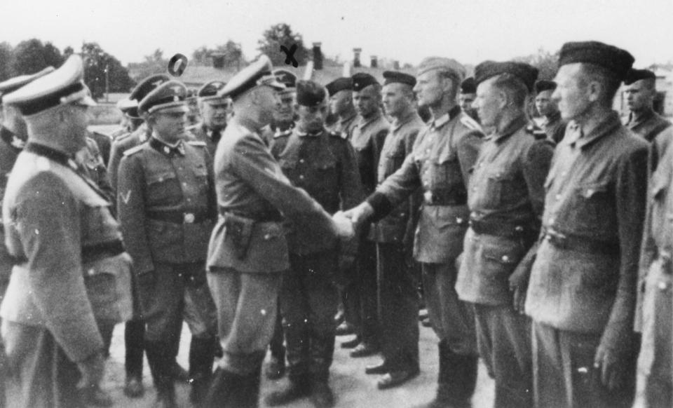  This 1942 photo Heinrich Himmler, centre left, shaking hands with new guard recruits at the Trawniki concentration camp where Palij worked