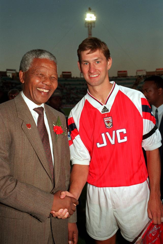  Meeting friends in high places, Adams is greeted by Nelson Mandela