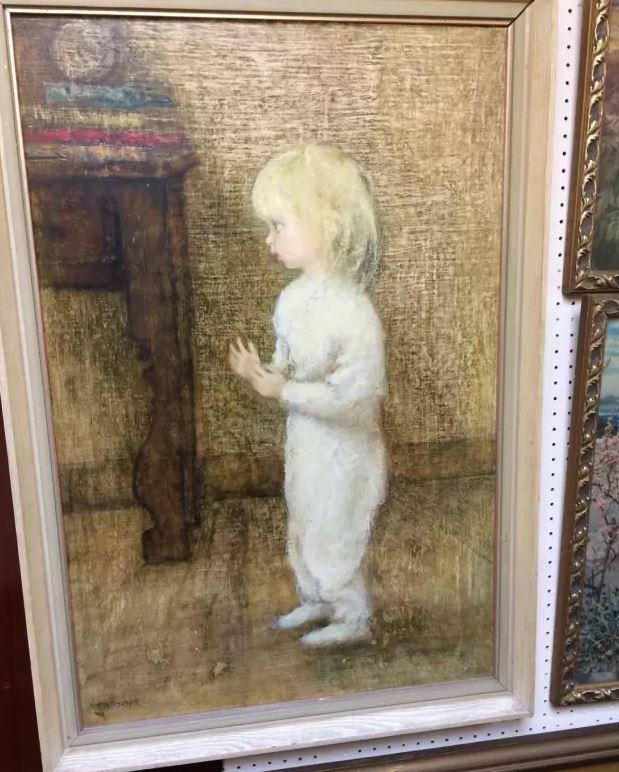  Many people have claimed they can see a 'ghost' of a cat or rabbit looking up at this creepy tot