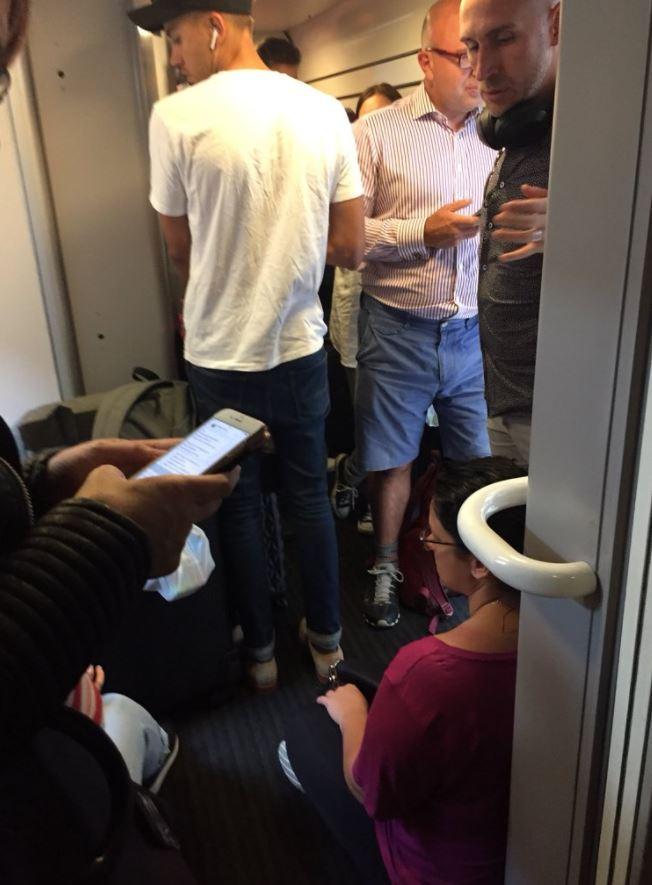  Brits heading off on Bank Holiday breaks are facing massive traffic woes such as on this cramped evening train from London to Teeside