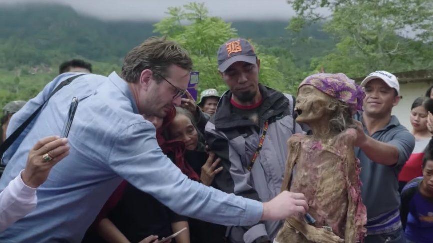  Dark Tourism's David Farrier inspects one of the many skeletons and skulls that are on display in the macabre festival