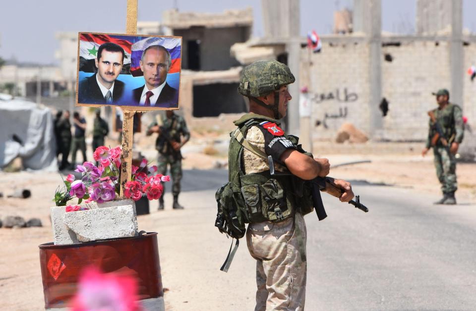  Russian and Syrian forces stand guard at the edge of Idlib, the last rebel-held province in a country that has suffered from nearly three years of conflict