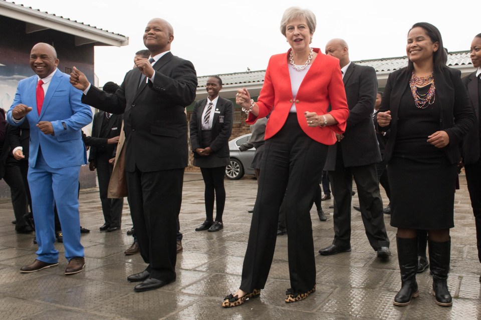 She got involved as she was greeted by schoolchildren in Cape Town