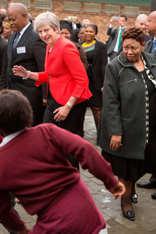  Theresa May danced with schoolkids during her trip to South Africa