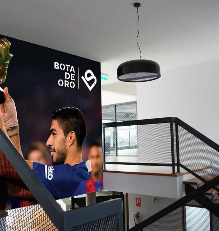  Pictures of the best moments of Suarez's career decorate the walls of the complex