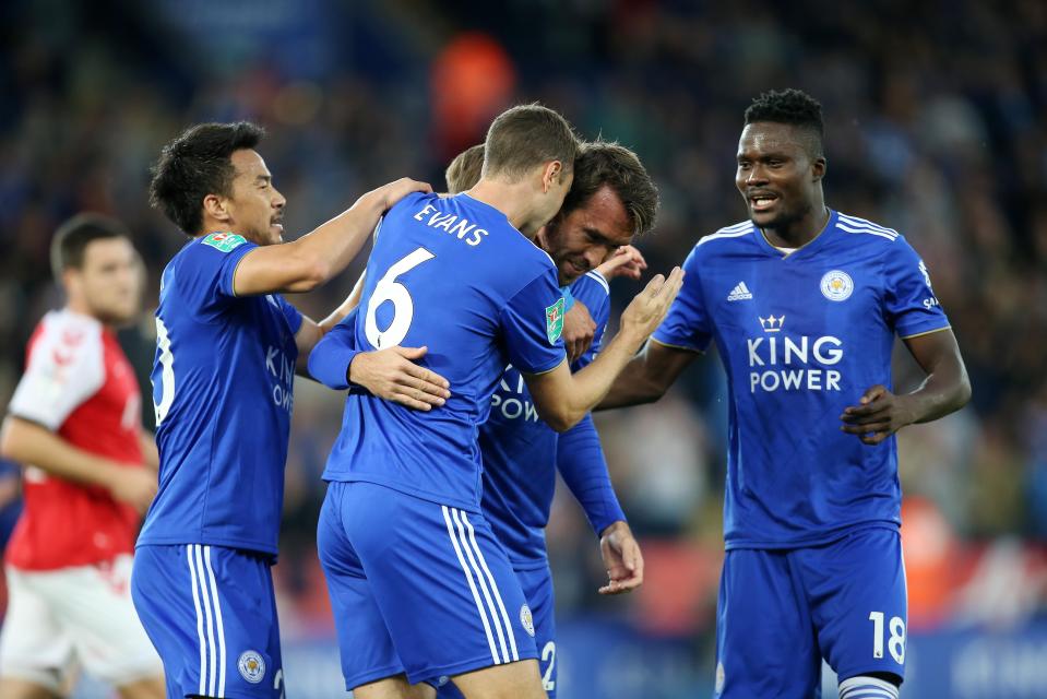  Christian Fuchs celebrates after giving Leicester the lead in romp