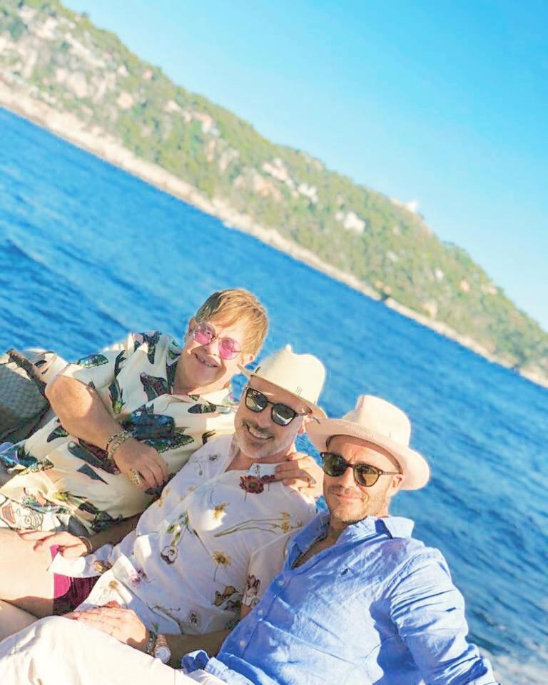  David and Elton pose with the singer's husband, David Furnish