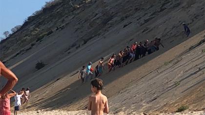  The moment the shark attack victim is carried off the beach by locals