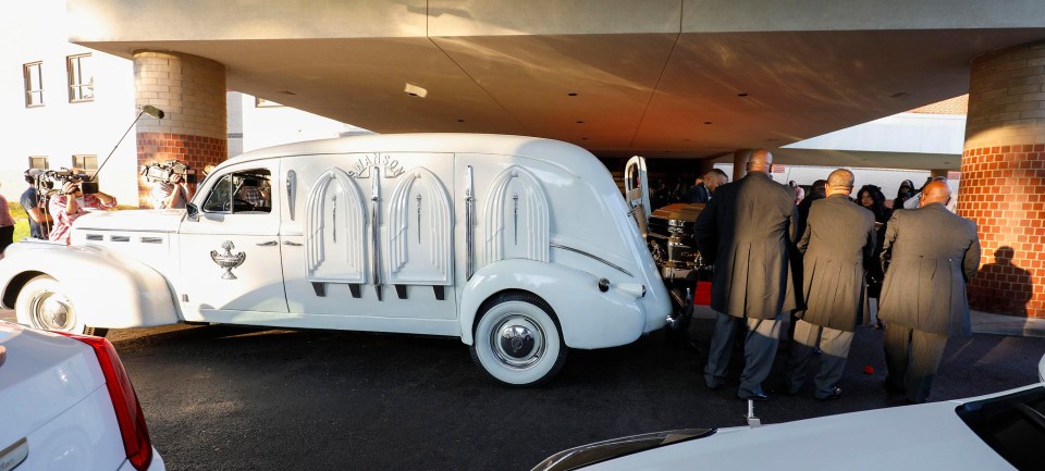 The singer’s body was transported to the service in Rosa Parks’ white hearse