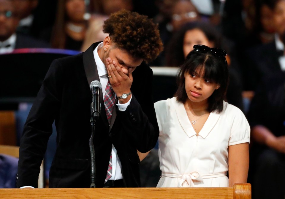 Jordan Franklin, left, pauses alongside his sister Victorie Franklin while speaking about their grandmother, Aretha 