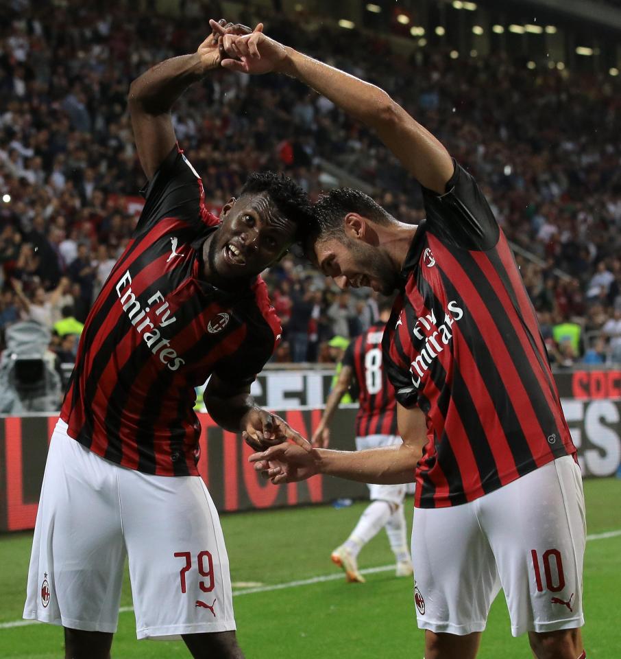  Kessie celebrates with team-mate Hakan Calhanoglu after netting in the 40th minute