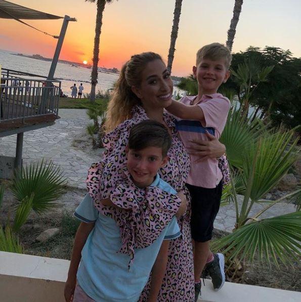  The TV star is on a sun soaked holiday with sons Zachary and Leighton