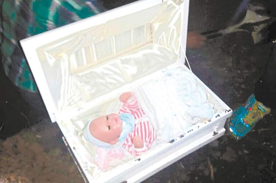 Deceived... When the coffin was opened a dressed baby doll was found inside 