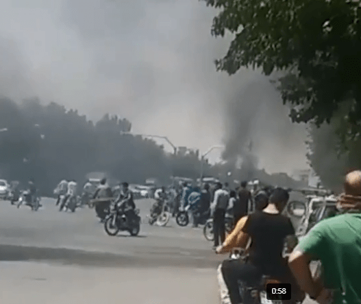  People burn tyres on the roads as the protests sweep across Iran