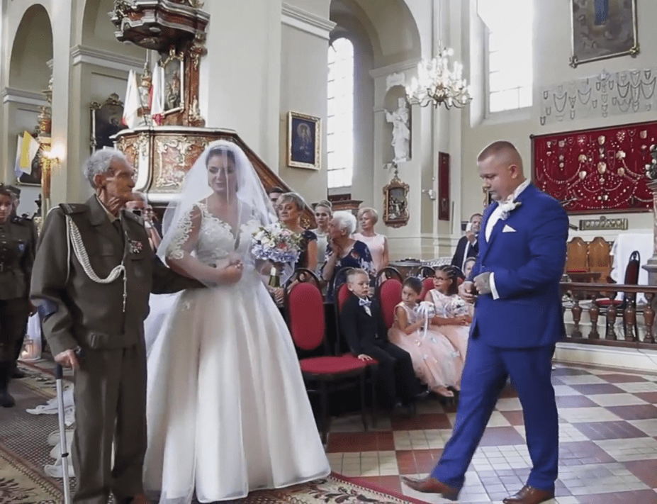  The groom made his way over to Bronislaw to take Joanna's hand in marriage