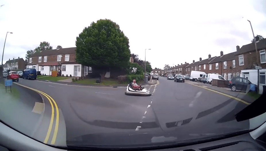 A driver was baffled to see a man in a bumper car on a public road