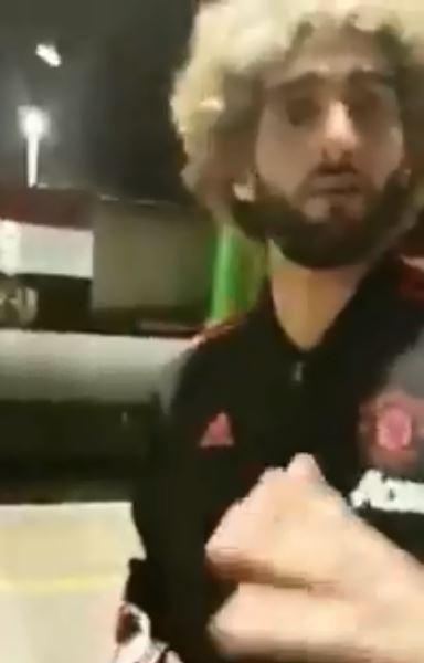  The man chatted to Marouane Fellaini who then realised he was trying to film the Manchester United stars