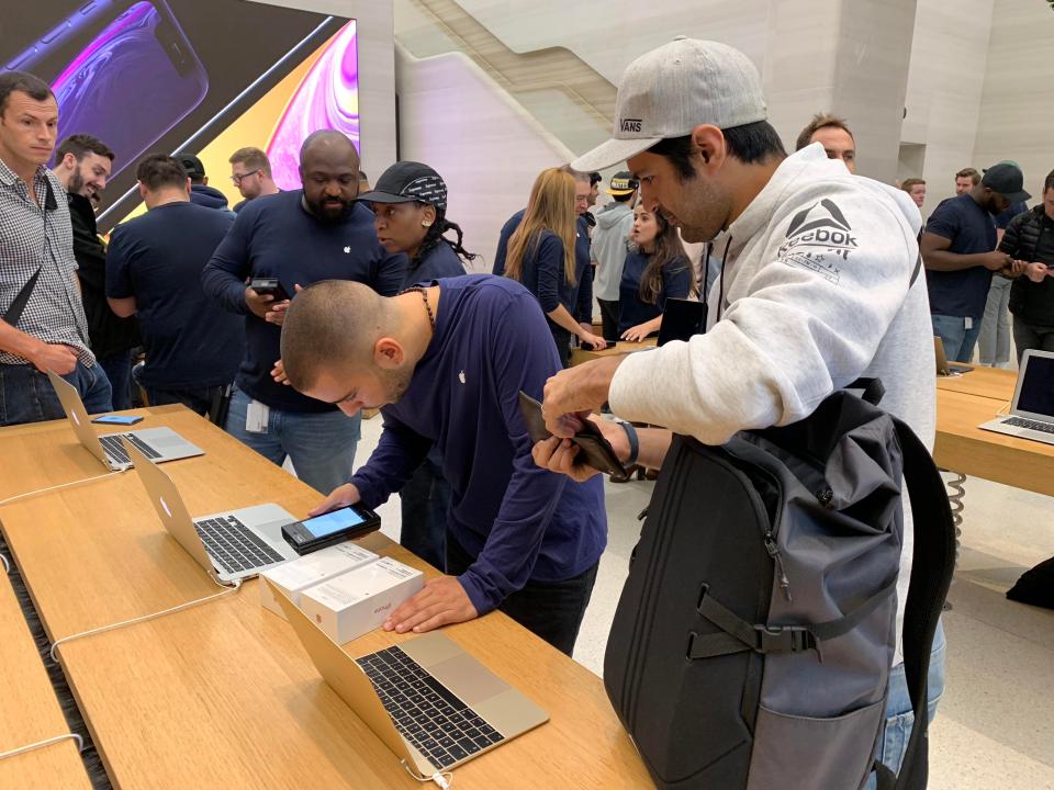  Apple Store employees were quick to get customers kitted out with their new handsets