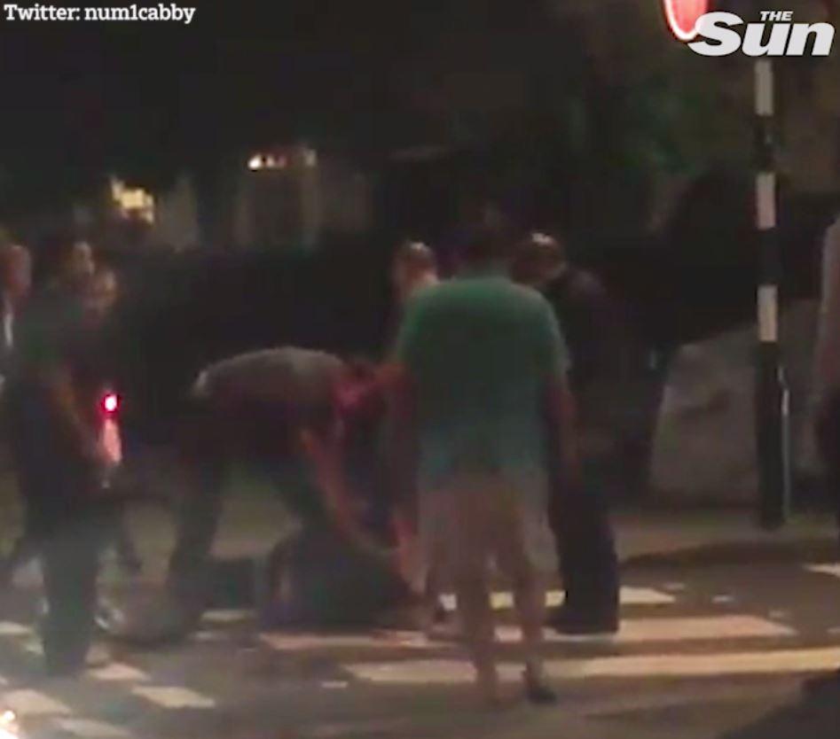  Alleged moped mugger is pinned to the ground