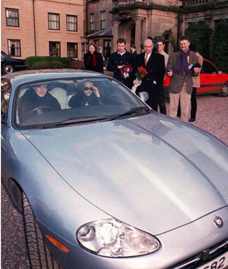  Posh and Becks leaving a hotel near Crewe in a Jaguar XK8