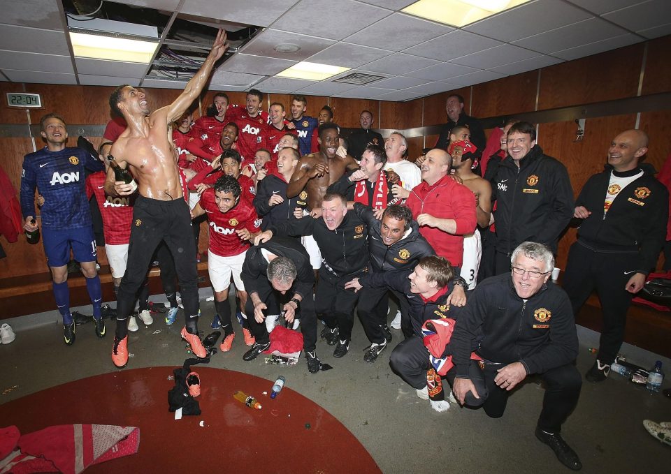  Manchester United players celebrate winning the Premier League in the home dressing room in 2012