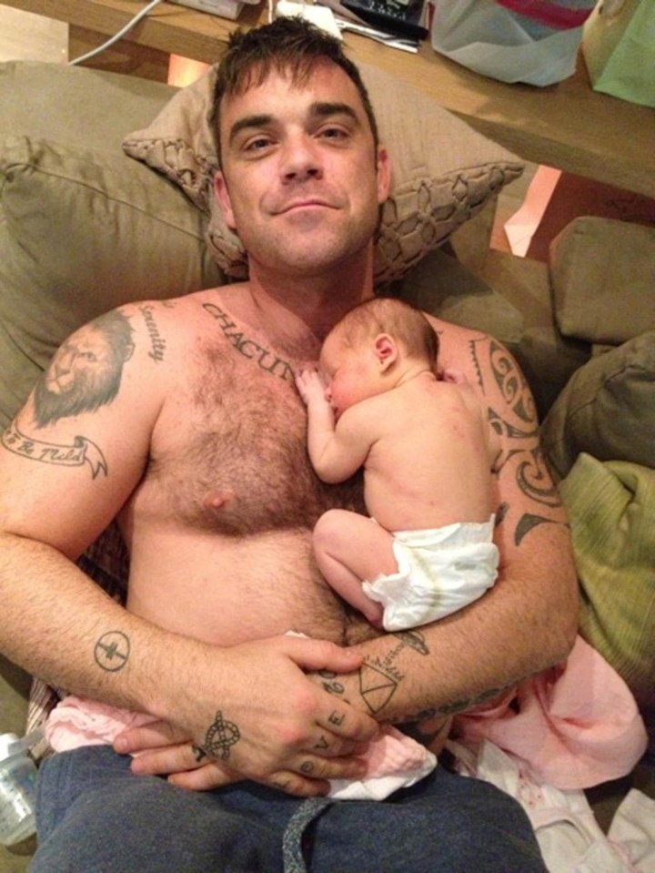 Robbie with his daughter Teddy in 2012