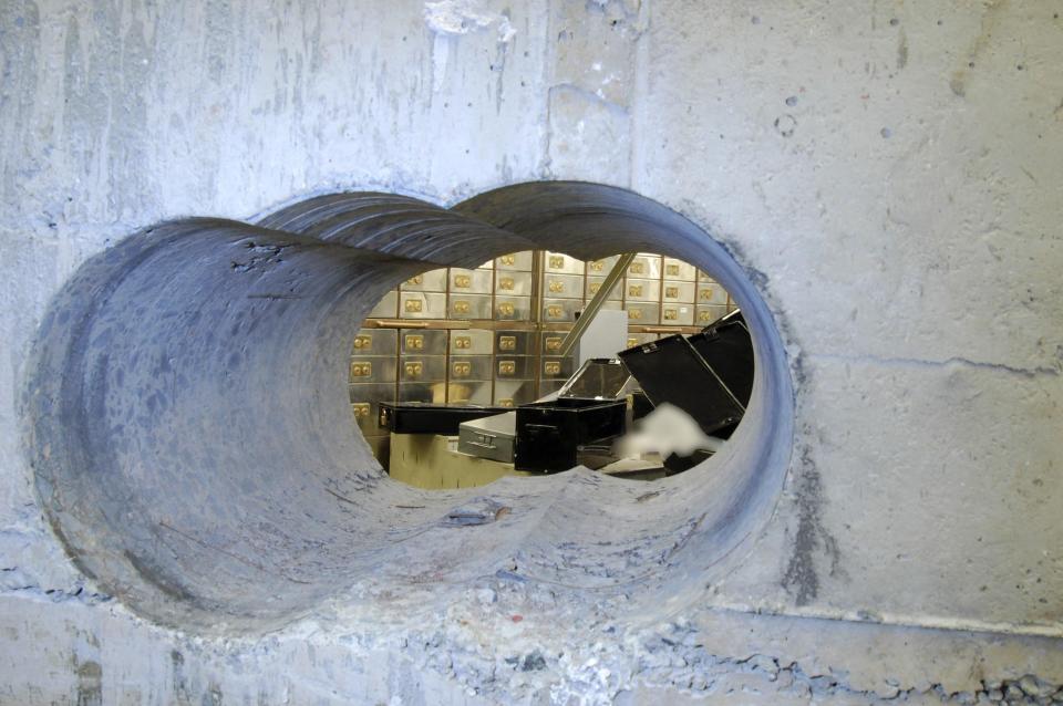  Holes bored through a half-metre thick concrete wall drilled to access a vault in a safe deposit centre in Hatton Garden